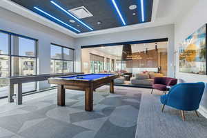 Recreation room with plenty of natural light, billiards table, carpet flooring, and recessed lighting