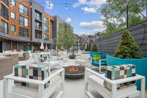 View of patio / terrace featuring an outdoor living space with a fire pit