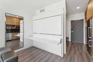 Interior space featuring wood finished floors and recessed lighting