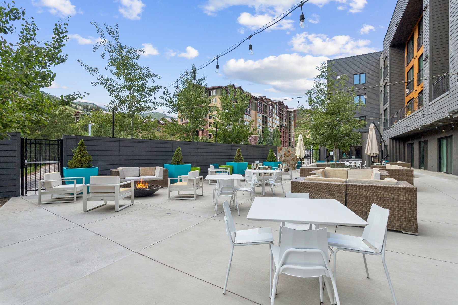 View of patio featuring an outdoor living space with a fire pit