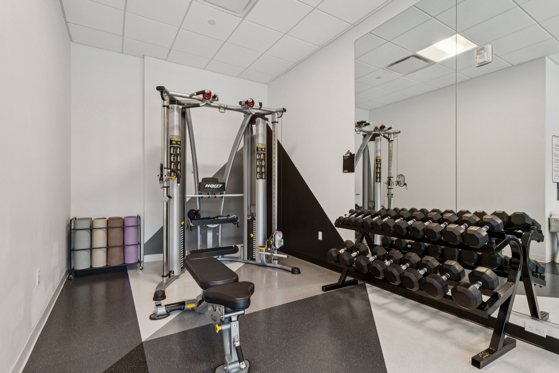 Exercise room featuring a drop ceiling