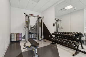 Exercise room featuring a drop ceiling