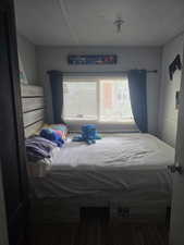 Bedroom featuring wood finished floors