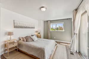 Bedroom with wood finished floors