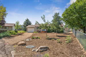 View of front of property featuring driveway and a garage