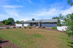 Ranch-style house with an attached garage, driveway, and brick siding