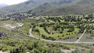 View of property location with a water and mountain view