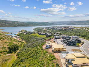 Aerial perspective of suburban area featuring a water and mountain view