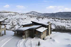 View of front of home with a chimney and a mountain view
