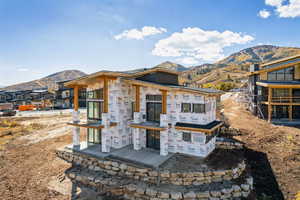 Back of property featuring a mountain view