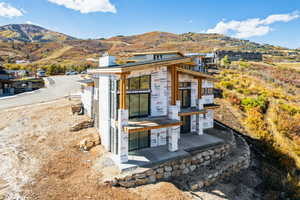 View of front facade with a chimney and a mountain view