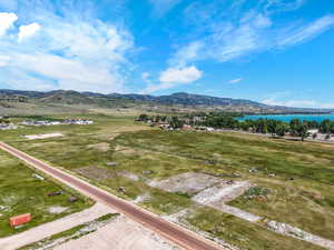 View of mountain backdrop featuring a nearby body of water