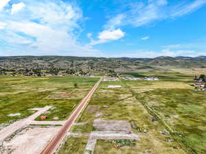 Aerial view of sparsely populated area with a mountainous background