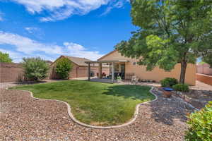 Fenced backyard with a patio area