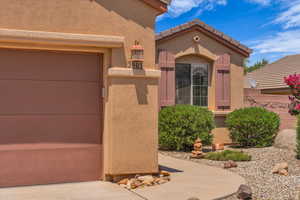 Doorway to property with stucco siding