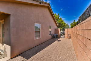 North side of home with a walk through gate to front yard