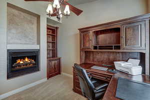 Beautiful Office has a double sided gas fireplace to the living room