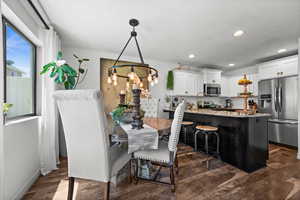 Dining space featuring  wood-type flooring, and recessed lighting