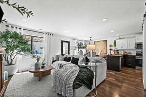 Living area featuring  wood finished floors and recessed lighting