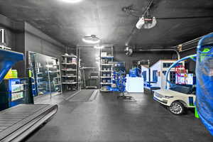 Garage featuring a garage door opener