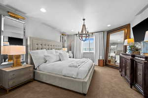 Bedroom with carpet floors, recessed lighting,