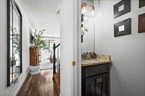 Bathroom featuring wood finished floors and vanity