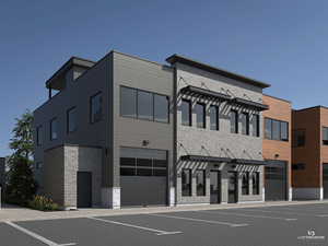 View of building exterior with a garage