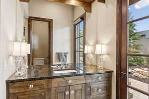 Bathroom featuring vanity and plenty of natural light