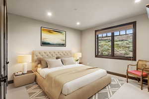 Carpeted bedroom featuring recessed lighting and baseboards