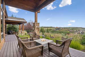 Wooden terrace with a fire pit
