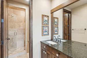 Bathroom with vanity and a shower stall