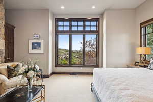 Carpeted bedroom featuring recessed lighting and baseboards