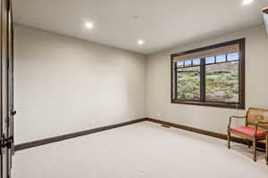 Unfurnished room featuring recessed lighting and carpet floors