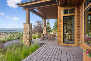 Wooden terrace with a mountain view and outdoor lounge area