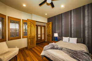 Bedroom featuring dark wood-style floors, recessed lighting, and ceiling fan