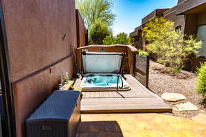 Wooden deck with a covered hot tub