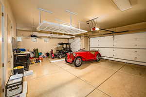 Garage featuring a garage door opener