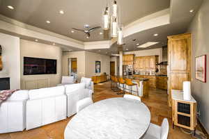 Living room featuring recessed lighting and a raised ceiling