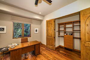 Office area with wood finished floors, ceiling fan, and recessed lighting