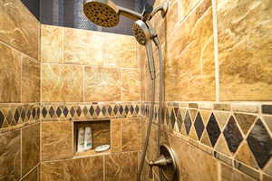 Bathroom view of a tile shower