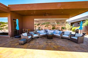 View of patio with an outdoor living space with a fire pit, a ceiling fan, and a grill