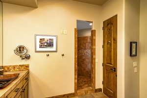 Full bathroom with vanity and walk in shower