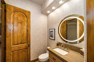 Bathroom with vanity and recessed lighting