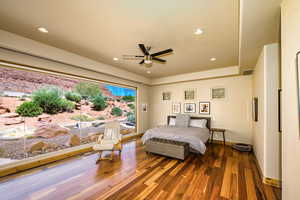 Bedroom featuring wood finished floors, recessed lighting, access to outside, and ceiling fan