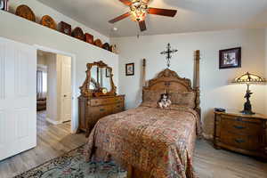 Bedroom featuring light wood finished floors and a ceiling fan