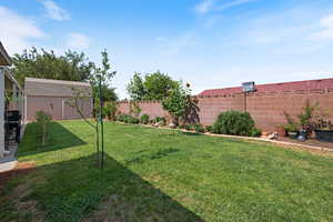 View of yard with an outbuilding