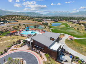Aerial view of a water and mountain view and a golf club