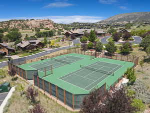 View of tennis court featuring a mountain view