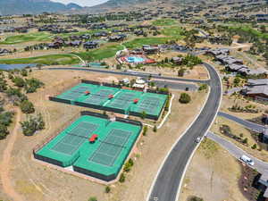 Drone / aerial view of a local golf course and a water and mountain view