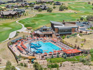 Bird's eye view of a pool and a golf course